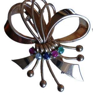 Broche en or et ses pierres précieuses en forme de nœud