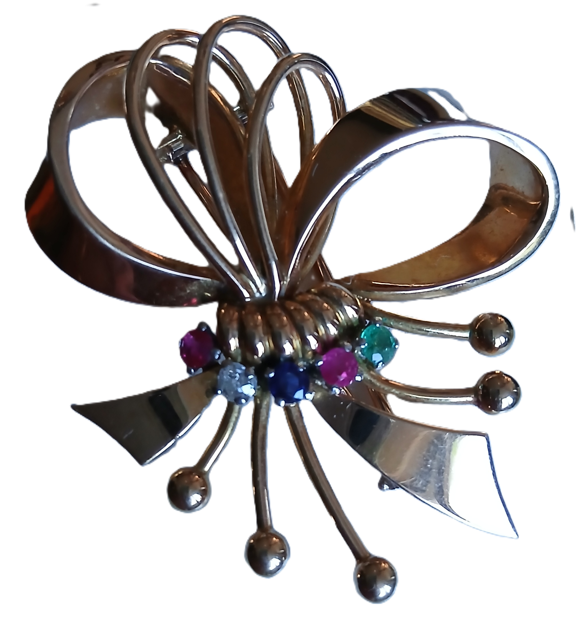 Broche en or et ses pierres précieuses en forme de nœud